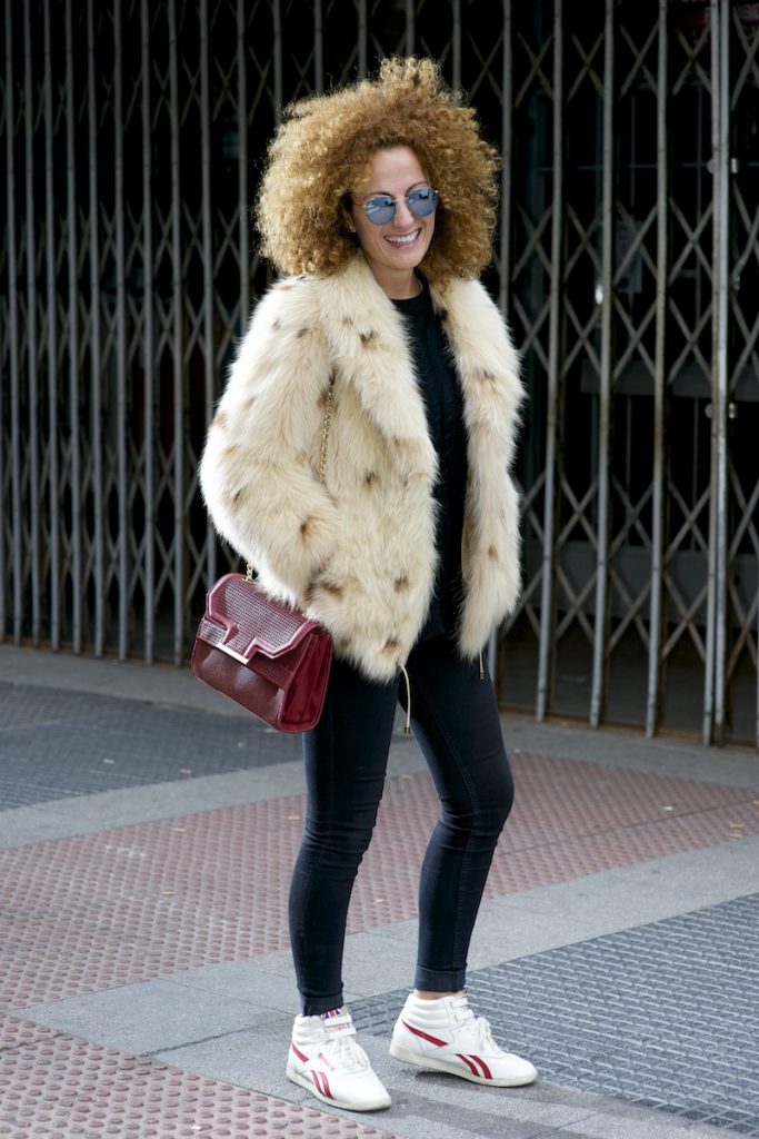 MADRID, SPAIN - MARCH 23: Rosa wears Reebok trainers, Zara trousers, sweater and hanbag, Piedad de Diego jacket, Aristocrazy ring and Ray Ban glases on March 23, 2015 in Madrid, Spain. (Photo by Juan Naharro Gimenez/Getty Images)